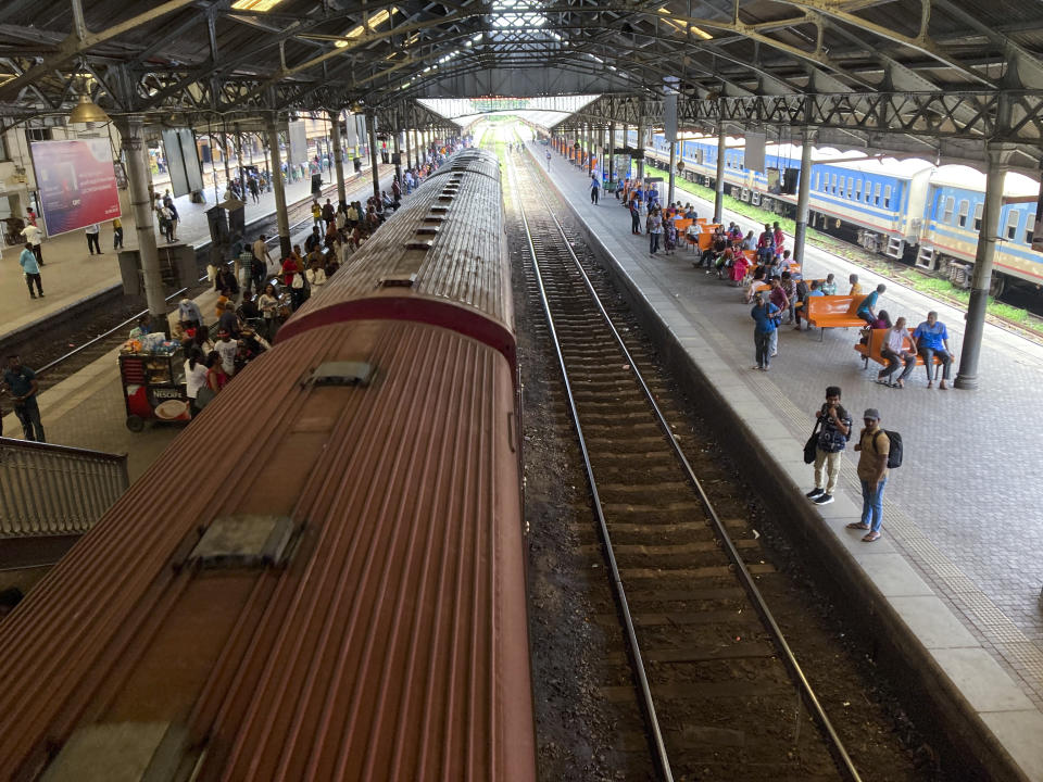 Commuters wait on a platform at the Fort railway station during a trade union strike by locomotive drivers in Colombo, Sri Lanka, Wednesday, Sept. 13, 2023. (AP Photo/Eranga Jayawardena)