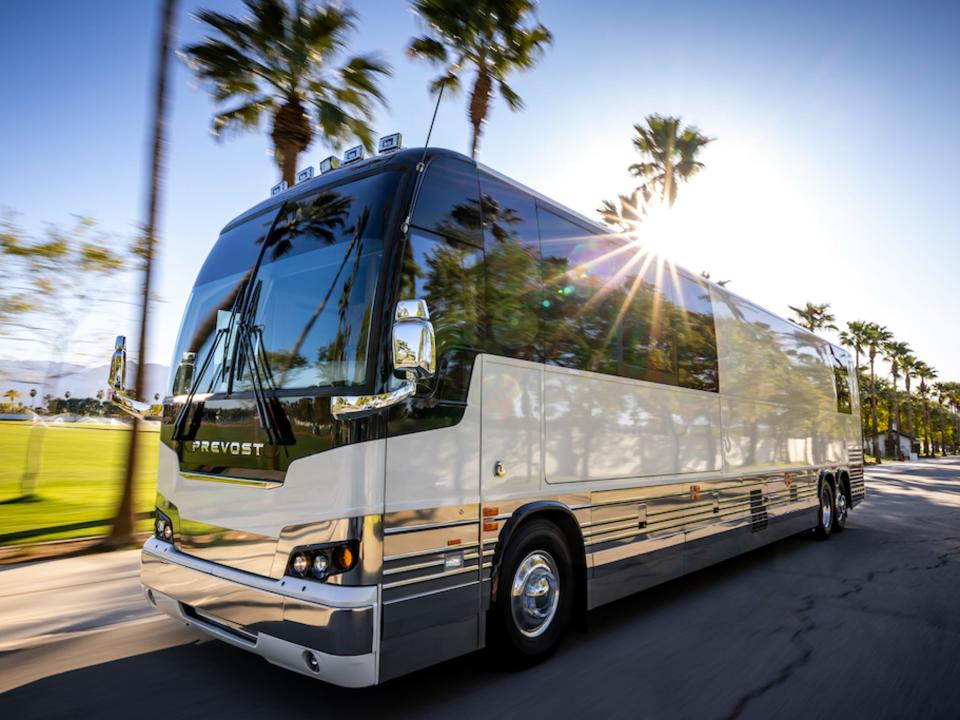 exterior of an artist bus with Dreamliner Luxury Coaches