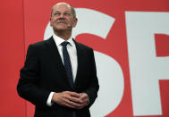 Olaf Scholz, top candidate for chancellor of the Social Democratic Party (SPD) addresses his supporters after German parliament election at the party's headquarters in Berlin, Sunday, Sept. 26, 2021. (AP Photo/Lisa Leutner)