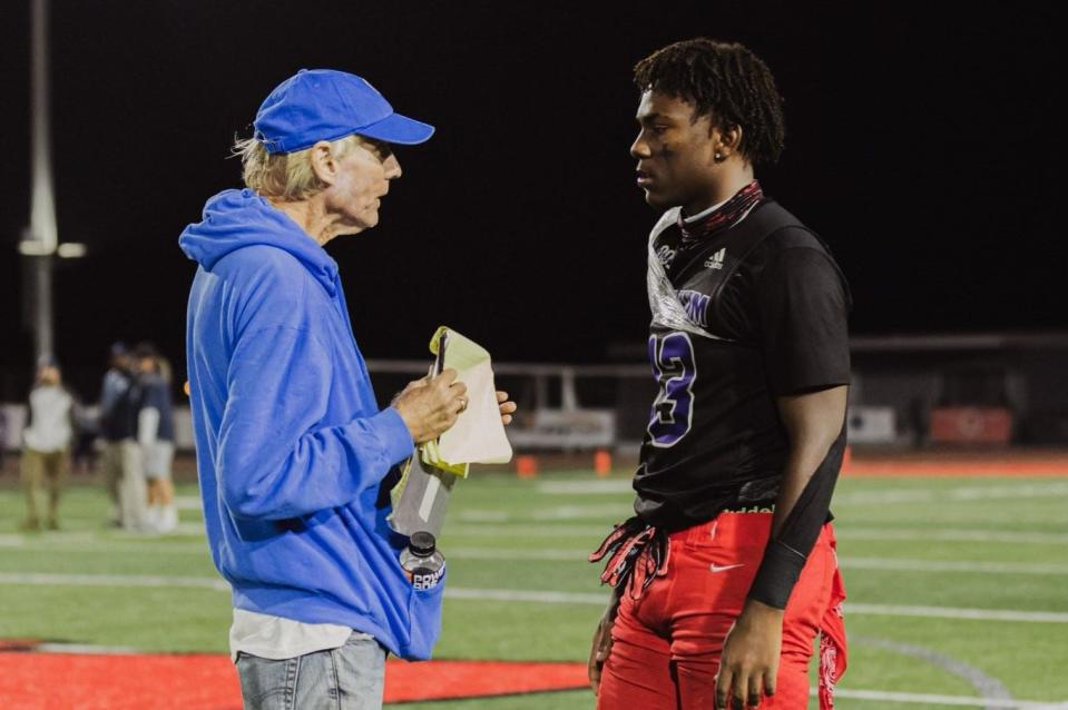 Loren Ledin interviews J’Lin Wingo after a Rio Mesa High football game. Ledin, who covered the county sports scene for more than 40 years, died Thursday at age 70.