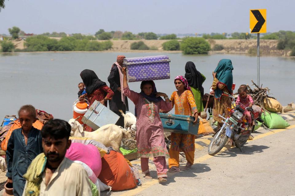 People move from flooded areas to safer ground in Sehwan, Jamshoro district, Sindh (AFP/Getty)