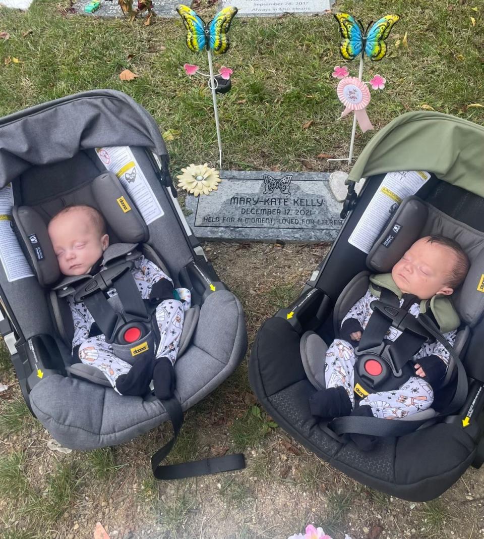 Duke Kelly (left) and Ford Kelly visited the grave of their sister Mary Kate shortly after they were home from the NICU. Mary Kate died in December 2021 after being delivered at 19.5 weeks gestation. Her gravestone reads "Held for a moment. Loved for eternity."