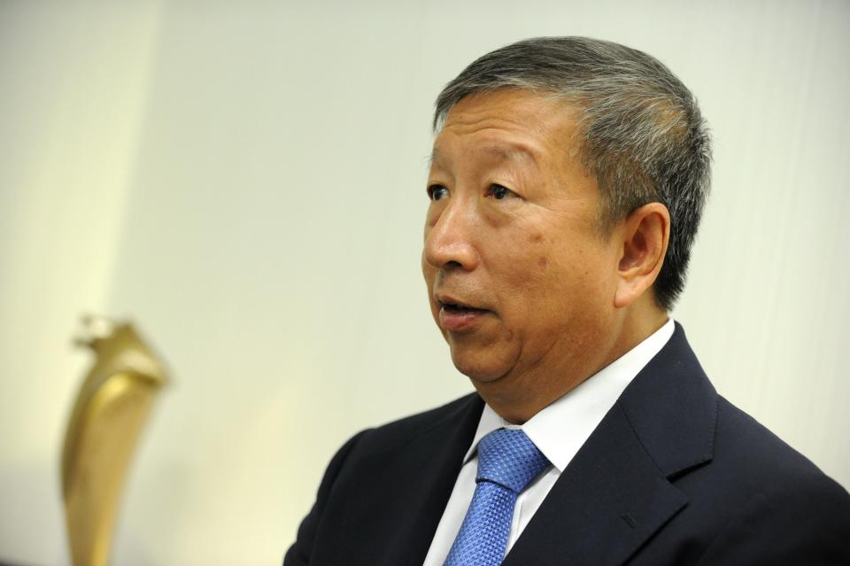 Would-be Olympics chief Ng Ser Miang speaks to an AFP reporter during an interview at his office in Singapore on August 26, 2013. Ng, one of six men vying to replace International Olympic Committee (IOC) president Jacques Rogge, said on August 26 he was heartened by Russia's promise not to discriminate against homosexuals at next year's Winter Games, adding the event would be "wonderful". AFP PHOTO / ROSLAN RAHMAN        (Photo credit should read ROSLAN RAHMAN/AFP via Getty Images)