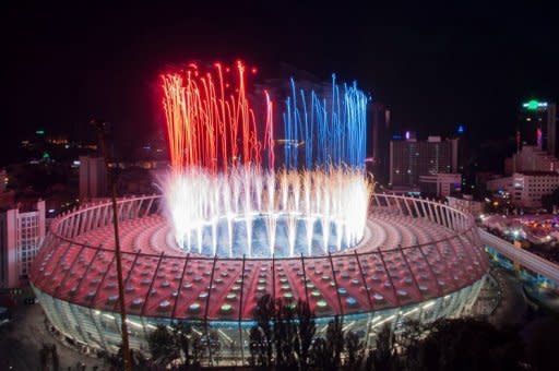 Fireworks are let off at the Olympic stadium in Kiev. Spain confirmed their status as one of the greatest national teams in football history by overwhelming Italy 4-0 in Sunday's Euro 2012 final in Kiev to retain their European crown