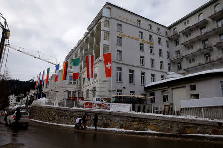 Flags flutter in front of the Steigenberger Belvedere hotel in the Swiss mountain resort of Davos, Switzerland, January 11, 2018 REUTERS/Arnd Wiegmann