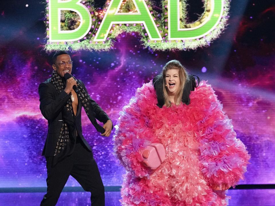 Host Nick Cannon and Kirstie Alley in "The Masked Singer."