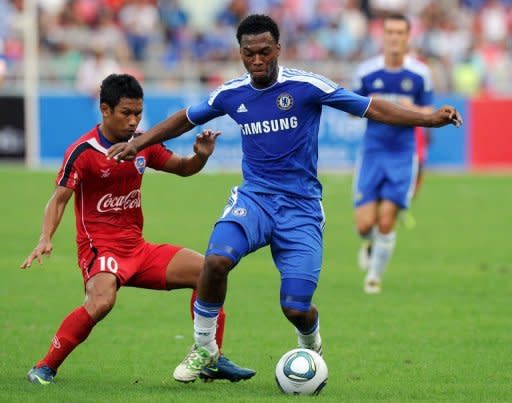 English Premier League team Chelsea player Daniel Sturridge (R) battles for the ball with Pipob Onmo of Thai Premier League All Stars during a football friendly match at Rajamangala stadium in Bangkok on July 24, 2011. Chelsea beat Thai Premier League All Stars 4-0