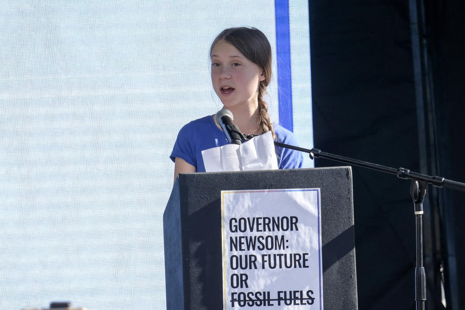 Climate change activist Greta Thunberg speaks after a climate change march in Los Angeles on Friday, Nov. 1, 2019. Thunberg says young people are rallying to fight climate change because their age leaves them with the most to lose from damage to the planet. (AP Photo/Ringo H.W. Chiu)