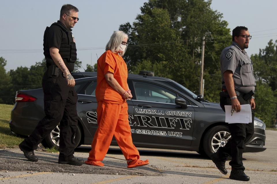 Pamela Hupp is escorted from the Lincoln County Justice Center to the detention center following a hearing, Tuesday, July 27, 2021, in Troy, Mo. Hupp, already serving a life sentence for murder, pleaded not guilty Tuesday in the stabbing death of her friend a decade ago. Hupp is charged with first-degree murder and armed criminal action in the death of Elizabeth “Betsy” Faria, in 2011. (Christian Gooden/St. Louis Post-Dispatch via AP)