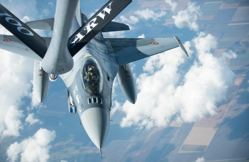 A Romanian Air Force F-16 prepares to receive fuel from a KC-135 Stratotanker from the 100th Air Refueling Wing, U.S. Air Force, over Romania, in September 2018. <em>U.S. Air Force photo by Tech. Sgt. Emerson Nuñez</em>
