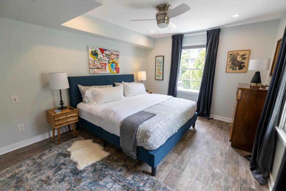 This bedroom at 510 Queens has a painting over the bed by Charlotte artist Jerri Tuck in collaboration with Micah Gaugh.