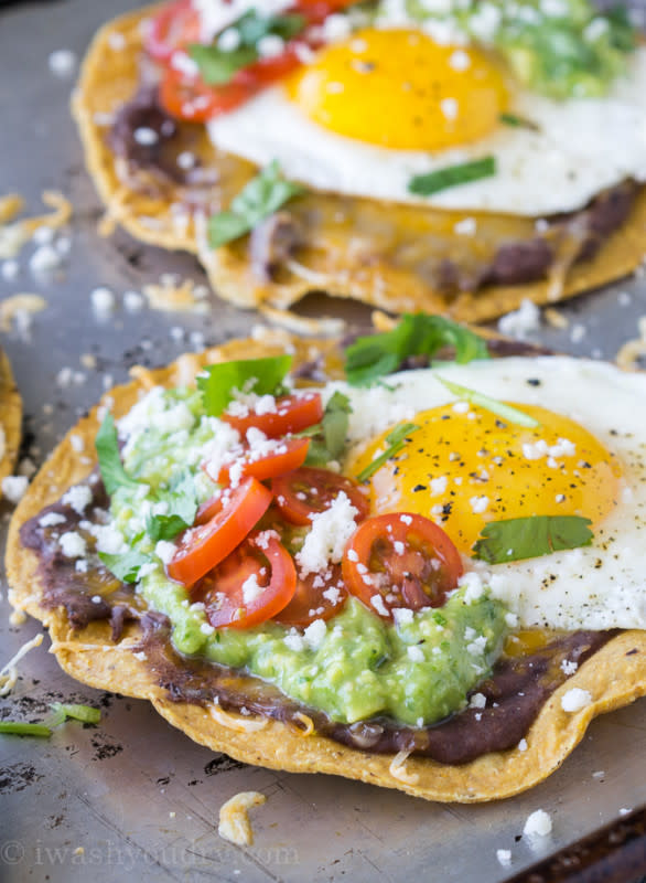 <p>Forget that trendy avocado toast, these huevos rancheros breakfast tostadas with avocado salsa verde are where it’s at!</p><p><a href="http://www.iwashyoudry.com/huevos-rancheros-breakfast-tostadas-avocado-salsa-verde/" rel="nofollow noopener" target="_blank" data-ylk="slk:Get the recipe here!;elm:context_link;itc:0;sec:content-canvas" class="link "><em><strong>Get the recipe here!</strong></em></a></p>
