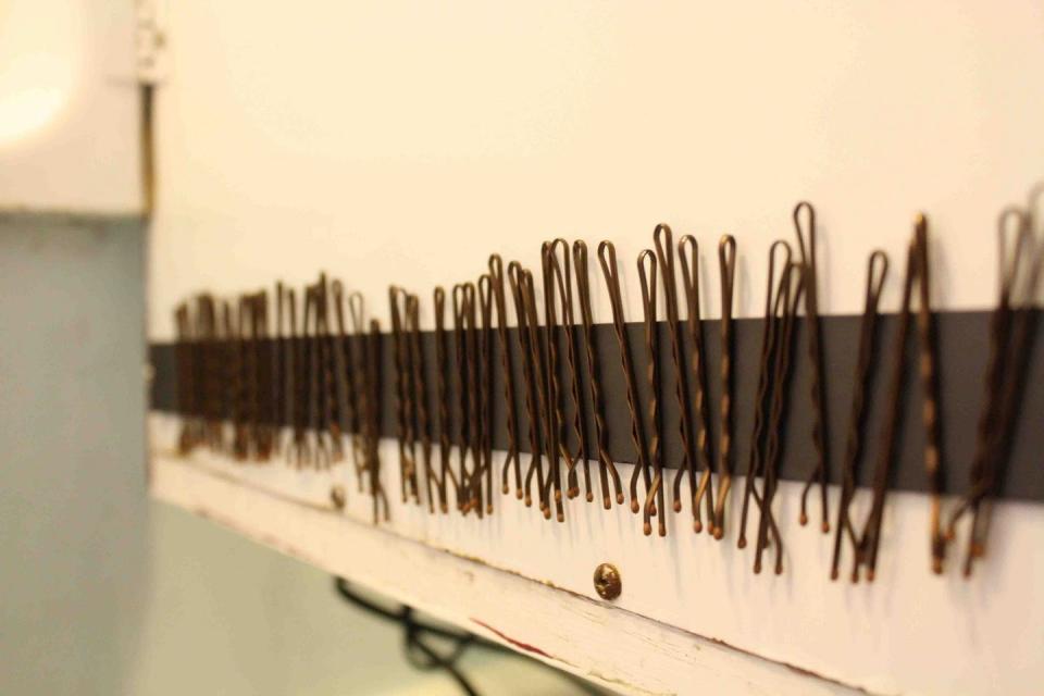 Wrangle bobby pins with a magnetic strip.
