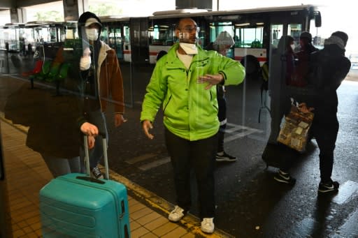 People wearing face masks were evacuated from the bus in Lyon