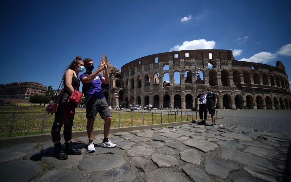 The Colosseum in Rome has reopened as Italy returns to life as usual - AFP