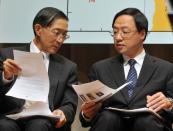 Taiwan's Foreign Minister David Lin (L) and Premier Jiang Yi-huah (R) talk during a press conference in Taipei on May 15, 2013. Taiwan Wednesday slapped sanctions on the Philippines, including a ban on the hiring of new workers, rejecting an apology by President Benigno Aquino for the killing of a Taiwanese fisherman