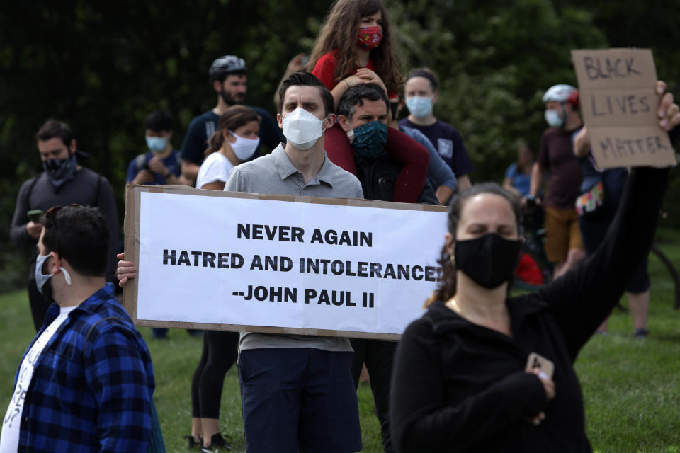 Demonstrators stage a protest near the Saint John Paul II National Shrine, which President Donald Trump visited on June 2 in Washington, D.C. (Photo: Alex Wong via Getty Images)