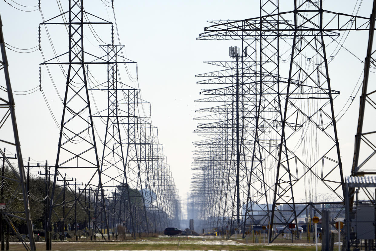 FILE - This Tuesday, Feb. 16, 2021 file photo shows power lines in Houston. The electric power grid manager for most of Texas has issued its first conservation alert of the summer, calling on users to dial back energy consumption to avert an emergency. The Energy Reliability Council of Texas issued the alert shortly after midday Monday, saying many forced generation outages and potential record June demand is squeezing the power supply. (AP Photo/David J. Phillip)