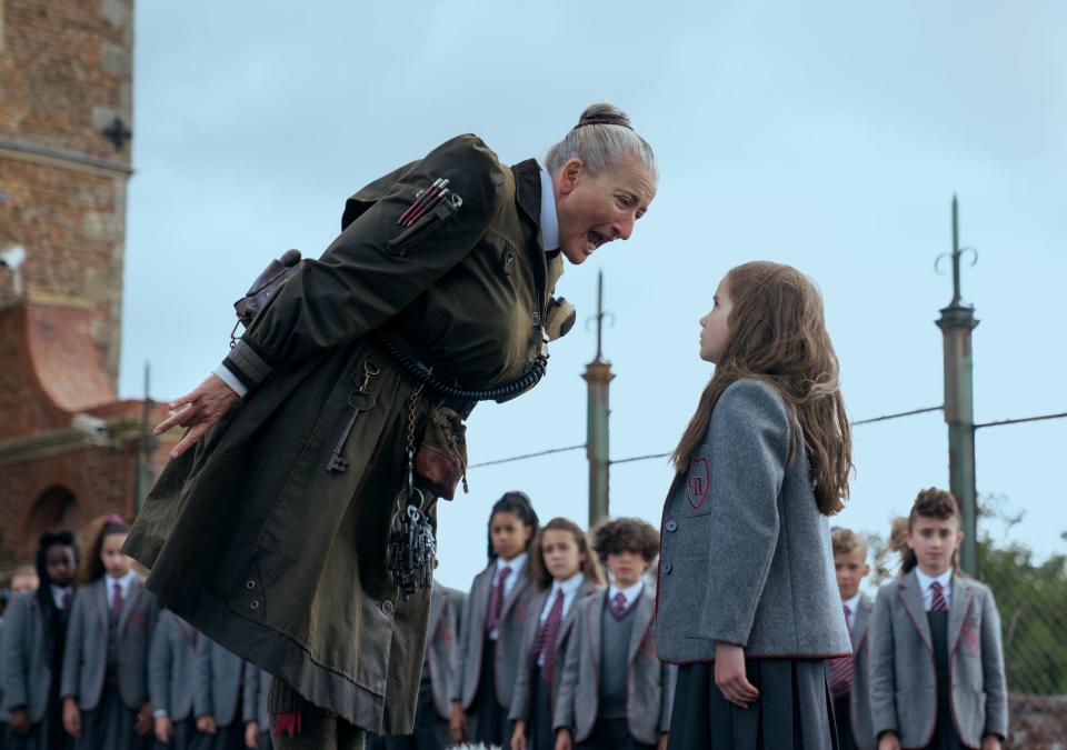 New student Matilda Wormwood (Alisha Weir, right) squares off with the Trunchbull (Emma Thompson) in a schoolyard scene from "Matilda."