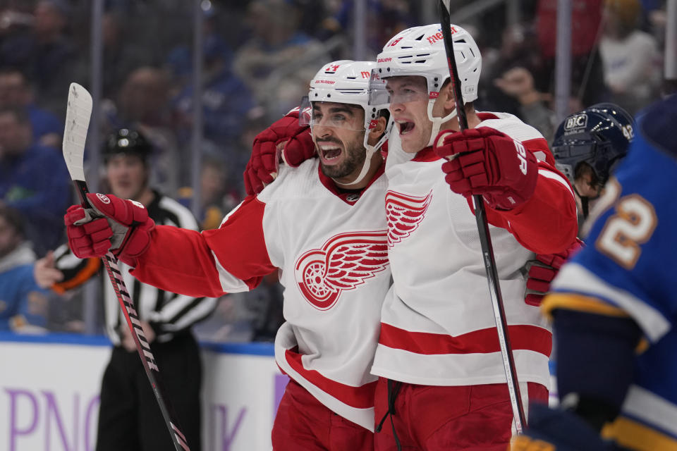 Detroit Red Wings' Robby Fabbri, left, celebrates with teammate Andrew Copp, right, after scoring during the third period of an NHL hockey game against the St. Louis Blues Tuesday, Dec. 12, 2023, in St. Louis. (AP Photo/Jeff Roberson)