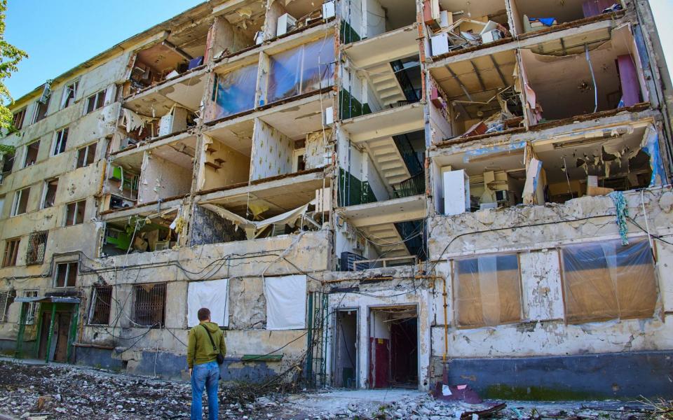 An apartment block damaged in Russian shelling of Kharkiv - EPA