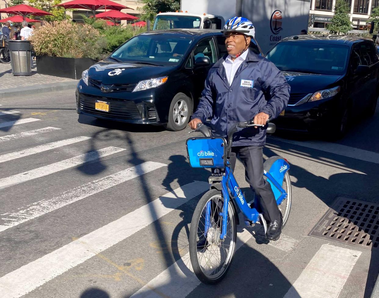 Democratic New York City mayoral candidate Eric Adams bikes in Greenwich Village in Manhattan, New York on Tuesday, Oct. 19, 2021.