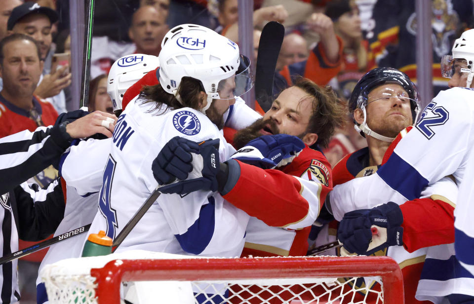 Tampa Bay Lightning left wing Pat Maroon, left, and Florida Panthers defenseman Radko Gudas scuffle during the second period of Game 2 of an NHL hockey second-round playoff series Thursday, May 19, 2022, in Sunrise, Fla. (AP Photo/Reinhold Matay)