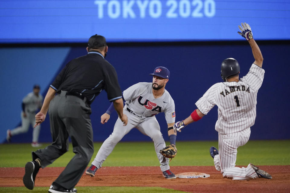 Japan's Tetsuto Yamada (1) steals second as United States' Eddy Alvarez looks for the throw during the ninth inning of a baseball game at the 2020 Summer Olympics, Monday, Aug. 2, 2021, in Yokohama, Japan. (AP Photo/Sue Ogrocki)