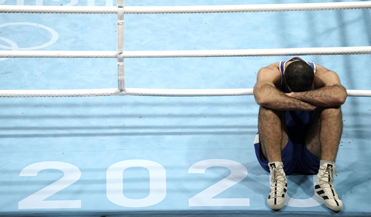 Aug 1, 2021; Tokyo, Japan; Mourad Aliev (FRA) refuses to leave the ring after being disqualified in his men's super heavy quarterfinal bout against Frazer Clarke (GBR) during the Tokyo 2020 Olympic Summer Games at Kokugikan Arena. Mandatory Credit: Andrew P. Scott-USA TODAY Sports