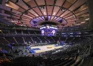 Fans arrive for an NBA basketball game between the Golden State Warriors and the New York Knicks on Tuesday, Feb. 23, 2021, in New York. A limited number of fans were allowed to attend. (Wendell Cruz/Pool Photo via AP)