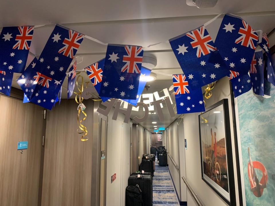 a hallway decorated with australian flags on a cruise