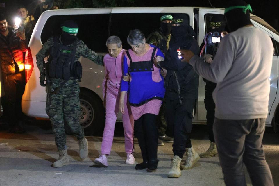 Newly-released hostages being handed over to the Red Cross in Rafah (AFP via Getty Images)