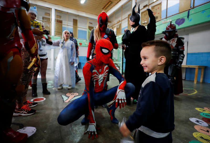 Argentine superheroes cheer up the children of prison inmates