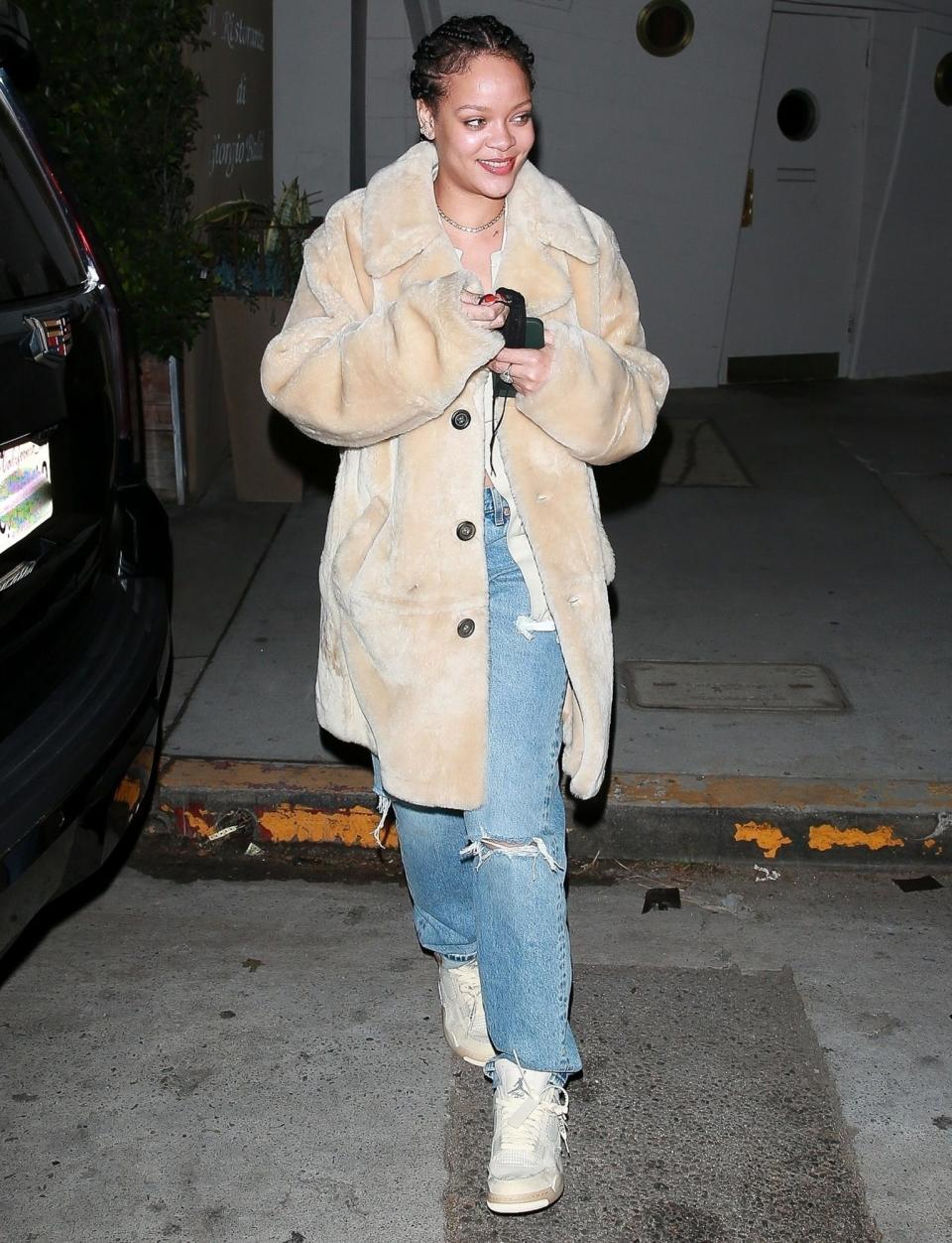 <p>Rihanna leaves dinner at Giorgio Baldi in Santa Monica on Wednesday, wearing a long coat, ripped jeans and sneakers.</p>