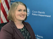 In this Friday, June 28, 2019, photo, Trish Heitman, community outreach specialist for the Coon Rapids, Minn., Police Department, poses for a portrait at the department's offices. The city opted not to partner with Ring and instead started its own in-house volunteer camera registry. Heitman, a community outreach specialist for the police department, said the city felt it was "almost inappropriate" for a government agency to promote one brand of camera over another. (AP Photo/Jeff Baenen)