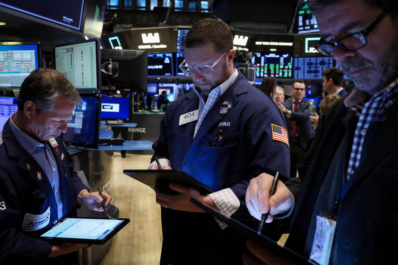 Traders work on the floor of the NYSE in New York