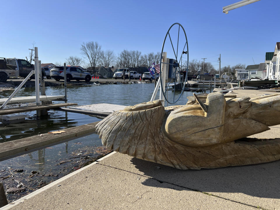 A statue lays on the ground on Orchard Island in Russells Point, Ohio, on Saturday, March 16, 2024. Thursday night’s storms left trails of destruction across parts of Ohio, Kentucky, Indiana and Arkansas. An Ohio sheriff in what appeared to be the hardest hit area says it's a surprise more people weren't killed in the storms. (AP Photo/Patrick Orsagos)