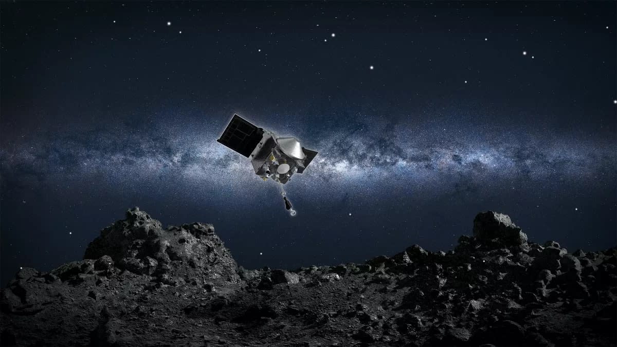  An artist's illustration of the OSIRIS-REx spacecraft poised to land on the asteroid Bennu. 