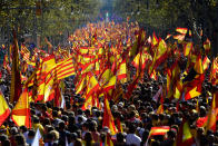 <p>Protesters wave Spanish and Catalan Senyera flags during a pro-unity demonstration in Barcelona on Oct.29, 2017. (Photo: Pierre-Philippe Marcou/AFP/Getty Images) </p>