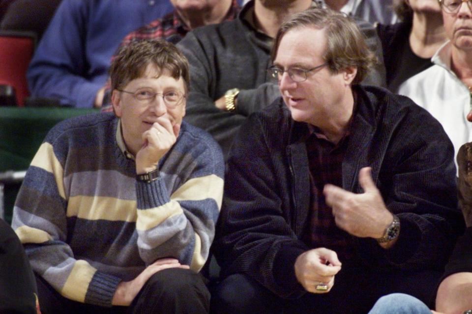 Microsoft co-founders Bill Gates (L) and Paul Allen (R) chat at courtside during the NBA game between the Seattle SuperSonics and the Portland Trailblazers at Key Arena in Seattle in 2003 (REUTERS)