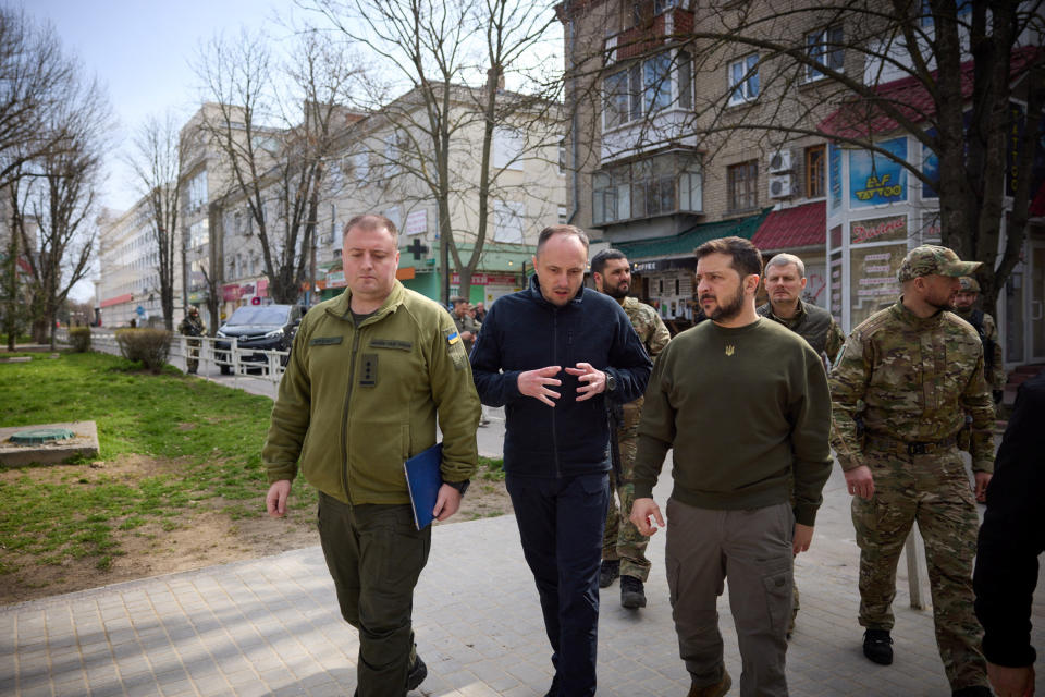 Ukraine's President Volodymyr Zelenskiy walks along a street, amid Russia's attack on Ukraine, as he visits Kherson, Ukraine March 23, 2023. Ukrainian Presidential Press Service/Handout via REUTERS ATTENTION EDITORS - THIS IMAGE HAS BEEN SUPPLIED BY A THIRD PARTY.