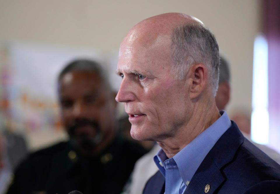 U.S. Sen. Rick Scott listens to area stakeholders at a roundtable on keeping children safe Wednesday in DeLand.