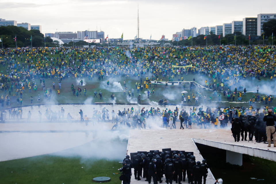 Supporters of Brazil's former President Jair Bolsonaro demonstrate against President Luiz Inacio Lula da Silva as security forces operate, outside Brazil’s National Congress in Brasilia, Brazil, January 8, 2023. REUTERS/Adriano Machado