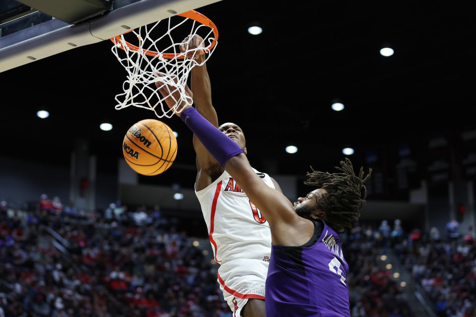 Bennedict Mathurin of the Arizona Wildcats dunks against Eddie Lampkin of the TCU Horned Frogs during Arizona's overtime win. (Photo by Sean M. Haffey/Getty Images)