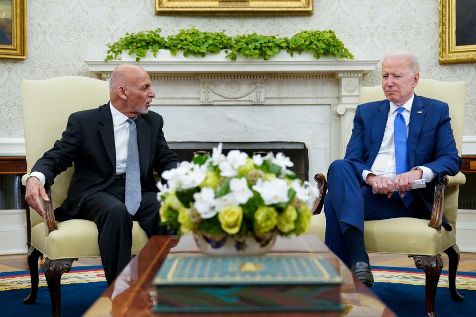 President Joe Biden, right, meets with Afghan President Ashraf Ghani, left, in the Oval Office of the White House in Washington on June 25, 2021. As the Taliban took over Kabul in August, Ghani fled the country.