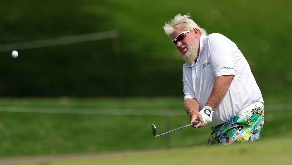 John Daly makes a shot from the rough on No. 11 during the second round of the Bridgestone Senior Players Championship at Firestone Country Club on Friday, June 25, 2021, in Akron, Ohio.