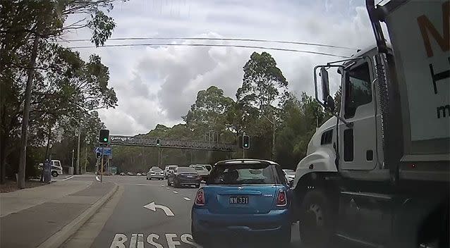 The truck begins to push the Mini Cooper as traffic speeds up. Source: Facebook/ Dash Cam Owners Australia