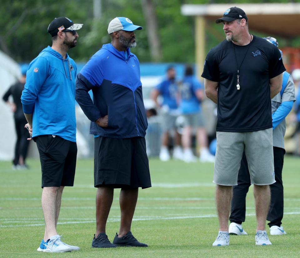 Detroit Lions Chief Operating Officer Mike Disner, GM Brad Holmes and Head Coach Dan Campbell watch drills during Rookie Minicamp Saturday, May 13, 2023. 