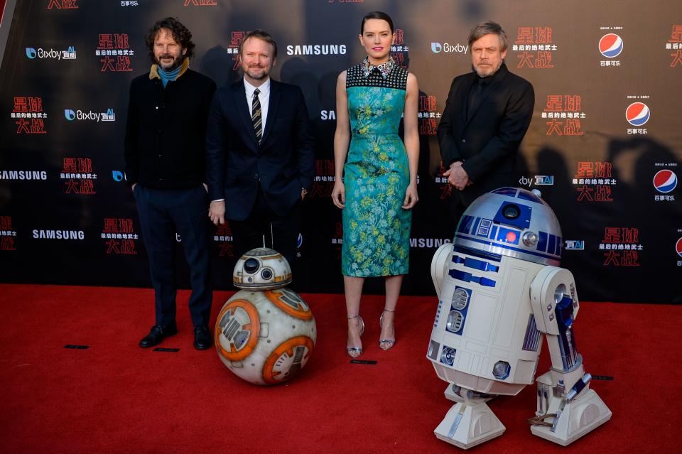 L-R Israeli film producer Ram Bergman, US film director Rian Johnson, British actress Daisy Ridley, US actor Mark Hamill pose at the red carpet for the Chinese premiere of 'Star Wars: The Last Jedi' at the Shanghai Disney Resort in Shanghai on December 20, 2017.  / AFP PHOTO / CHANDAN KHANNA        (Photo credit should read CHANDAN KHANNA/AFP via Getty Images)