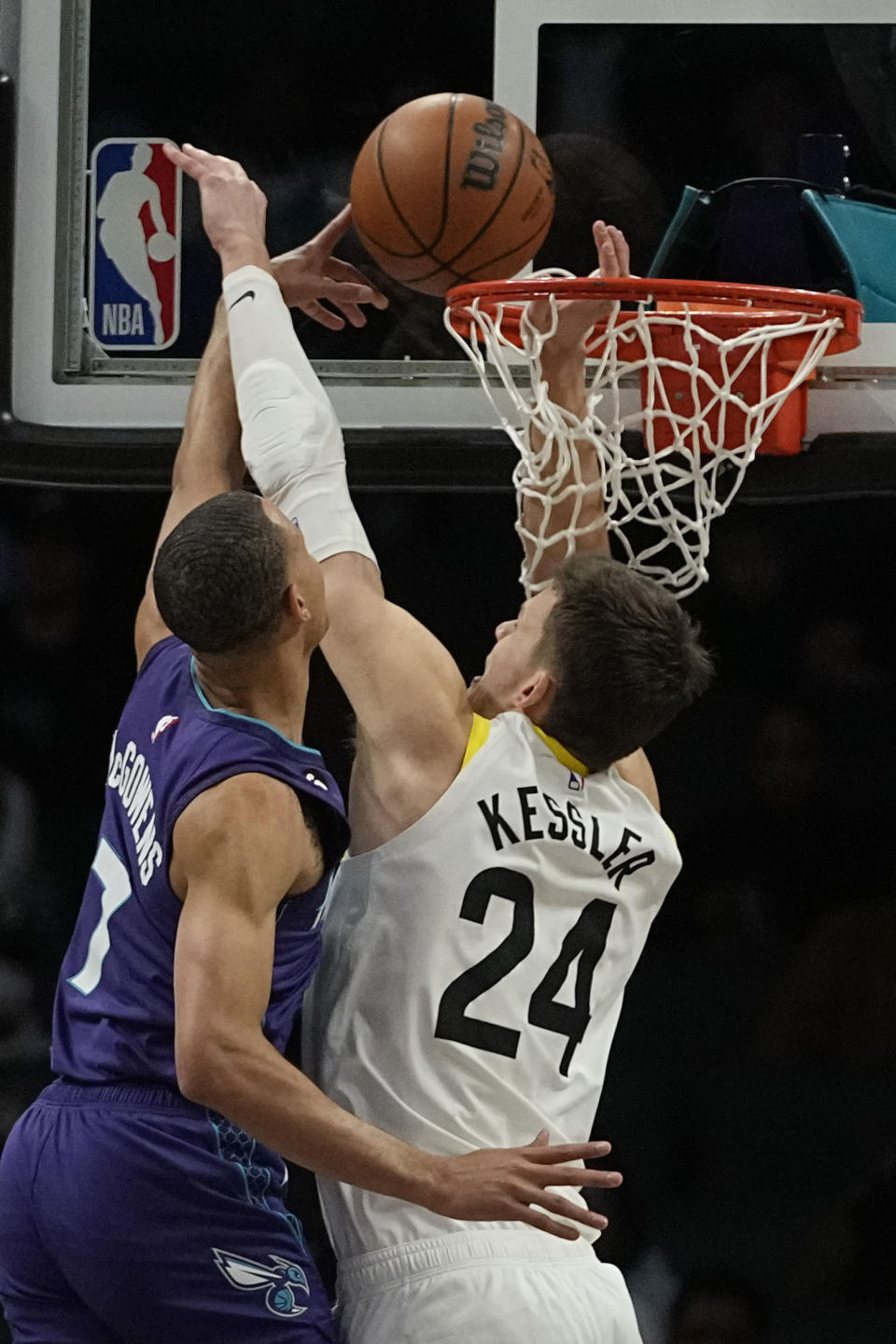 Utah Jazz center Walker Kessler blocks shot by Charlotte Hornets guard Bryce McGowens during the first half of an NBA basketball game on Saturday, March 11, 2023, in Charlotte, N.C. (AP Photo/Chris Carlson)